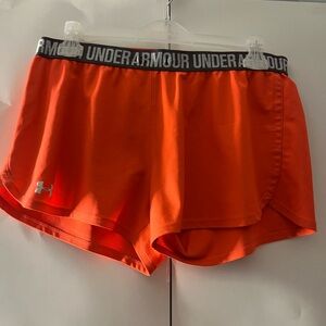 Women’s orange Under Armour running shorts